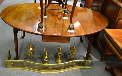 Lot 1341 - A Georgian mahogany oval drop-leaf dining table on pad feet