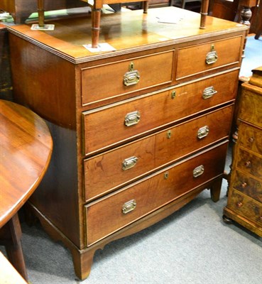 Lot 1345 - A Georgian oak four height chest of drawers