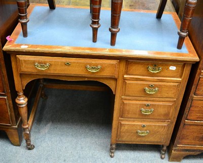 Lot 1346 - A late Victorian oak writing table