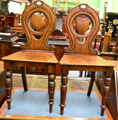 Lot 1347 - A pair of Victorian mahogany hall chairs