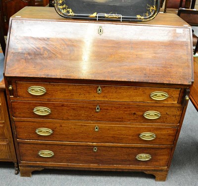 Lot 1348 - An early 19th century mahogany bureau