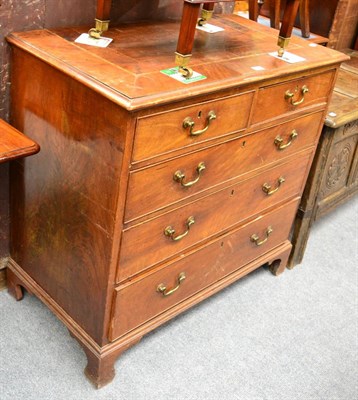 Lot 1355 - A Georgian mahogany four height chest of drawers with checkered inlay to the top