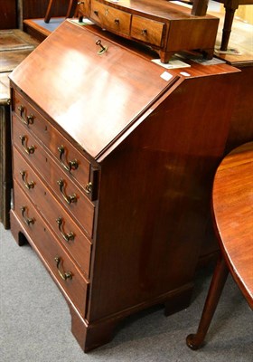 Lot 1357 - A Georgian mahogany bureau