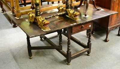 Lot 1360 - A late 18th century drop leaf oak dining table and an 18th century oak blanket chest (2)