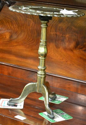 Lot 1398 - A George III brass trivet in the form of a tripod table circa 1800, with a tilt top and knopped...