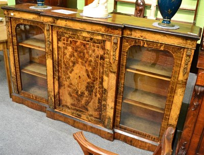 Lot 1399 - A Victorian walnut breakfront credenza with brass mounts