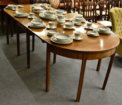 Lot 1400 - A Georgian mahogany D-end dining table