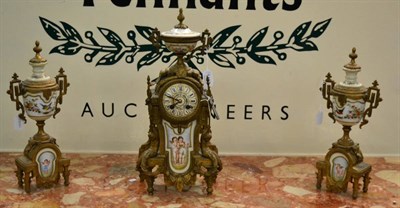 Lot 1415 - A composite Continental gilt metal mounted clock garniture