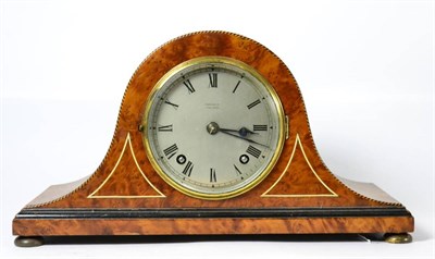 Lot 34 - A striking inlaid mantel clock, retailed by Finnigans ltd, Manchester