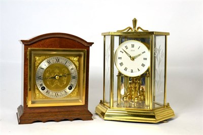Lot 38 - A striking mantel clock, signed Elliott, and a glass panelled mantel timepiece, signed Kundo (2)