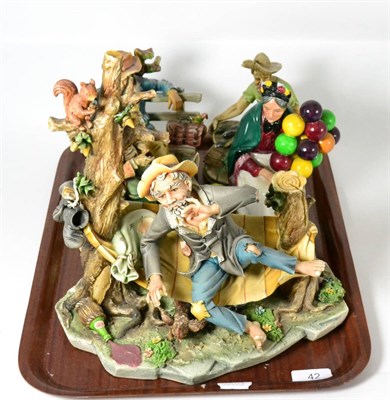 Lot 42 - Four Capodimonte figures and a Royal Doulton figure ''The Old Balloon Seller'' HN1315