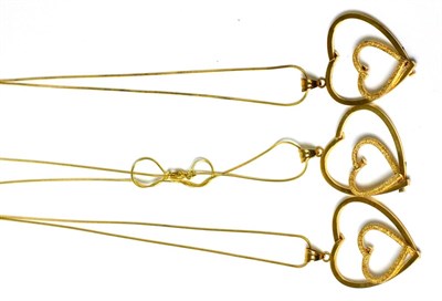 Lot 77 - Three gold coloured heart pendants