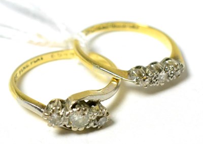 Lot 83 - Two 18ct gold and platinum rings, each set with three diamonds