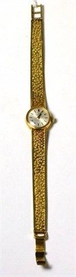 Lot 89 - Omega 9ct gold lady's wristwatch with integral bracelet