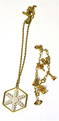 Lot 99 - A ";silk road"; charm bracelet stamped '14K' with a franklin mint ";snow crystal"; pendant,...