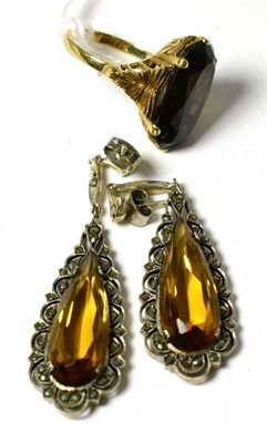 Lot 105 - A smokey quartz ring and a pair of marcasite drop earrings