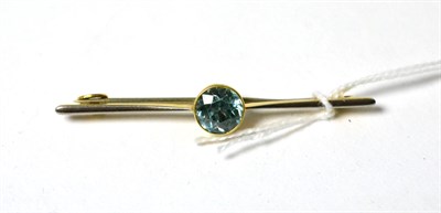 Lot 108 - A blue zircon set bar brooch, stamped '15CT', with a platinum fronted bar