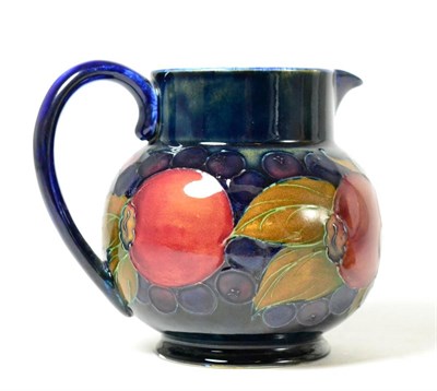 Lot 114 - A Moorcroft pomegranate and grape pattern jug