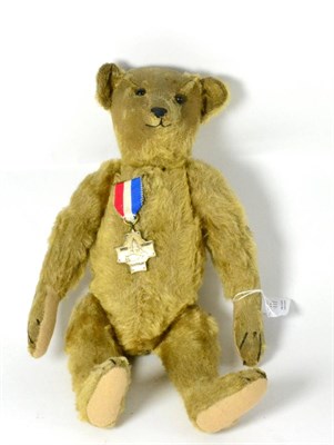 Lot 117 - Early 20th century yellow mohair Steiff Teddy bear, with jointed body, humped back, growler,...