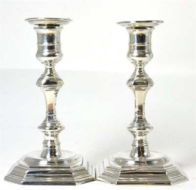 Lot 120 - A pair of Georgian style candlesticks by James Dixon & Son, Sheffield