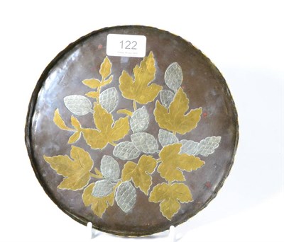 Lot 122 - A Benham and Froud mixed metal circular tray, designed by Christopher Dresser, inlaid with fruiting