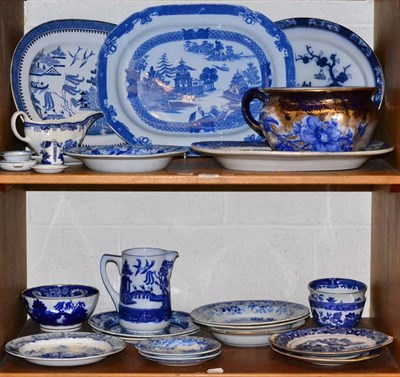 Lot 158 - A quantity of blue and white meat plates, bowls, chamber pot etc (on two shelves)