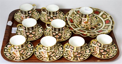 Lot 177 - Nine Royal Crown Derby coffee cans and saucers, two Royal Crown Derby side plates