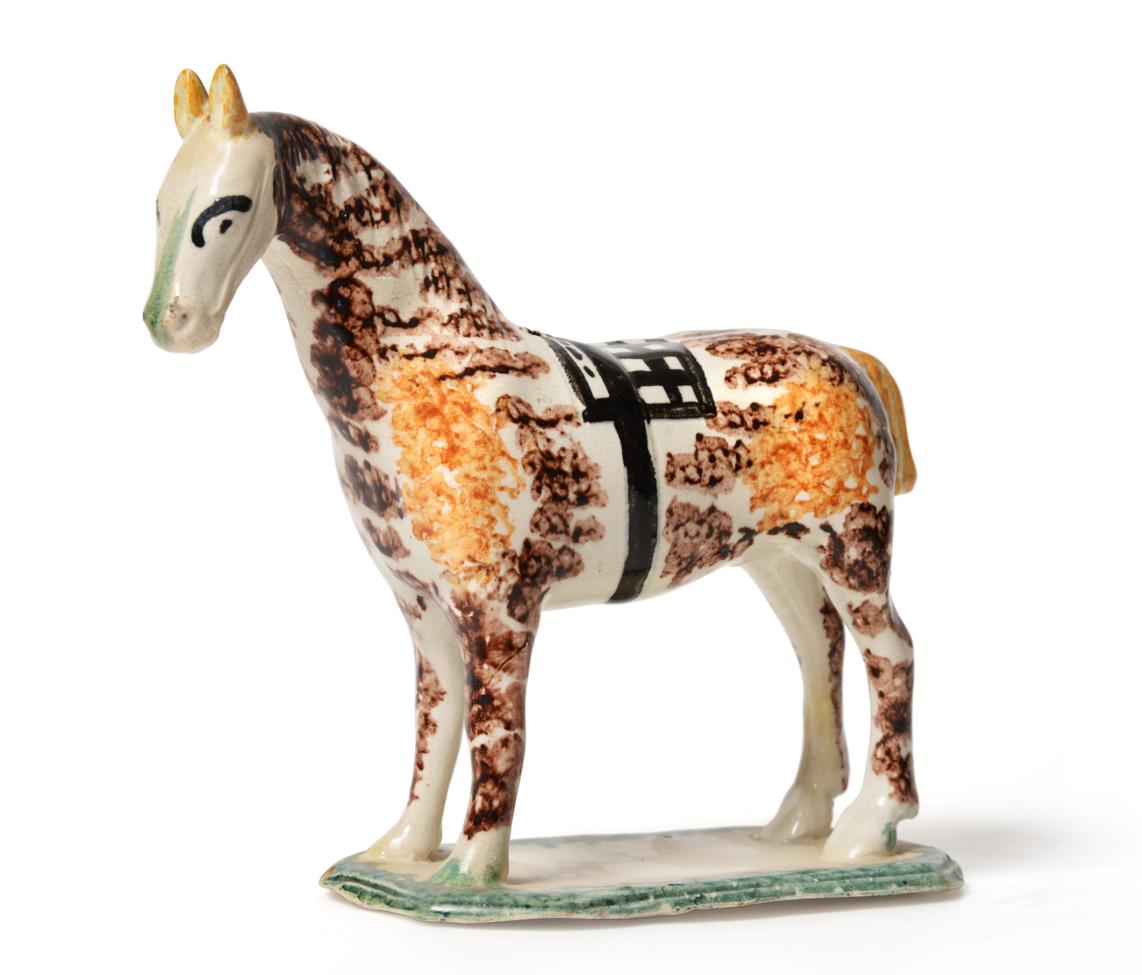 Lot 47 - A Pratt Type Figure of a Horse, possibly Newcastle, circa 1810, standing four square with brown and