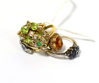 Lot 222 - Two 9ct gold gem set rings, another stamped '9CT' and another gem set ring (5)