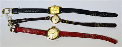 Lot 230 - A lady's plated wristwatch signed Omega and two other lady's wristwatches (3)