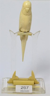 Lot 267 - An Art Deco Continental ivory budgerigar on an acrylic stand, 21.5cm  Provenance: By repute...