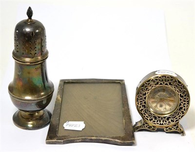 Lot 279 - A silver desk timepiece, a silver castor and a silver photograph frame (3)