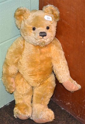 Lot 301 - A circa 1950's large plush jointed teddy bear, with stitched nose, mouth and claws, glass eyes,...