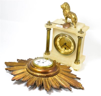 Lot 328 - A mantel timepiece and a sunburst wall timepiece