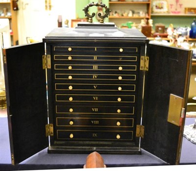 Lot 333 - A 19th century small ebony and brass inlaid cabinet containing small drawers