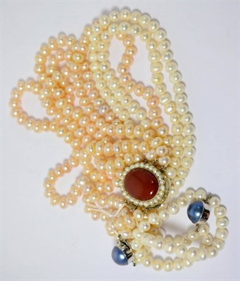 Lot 370 - Two pearl necklaces and a pearl bracelet (3)