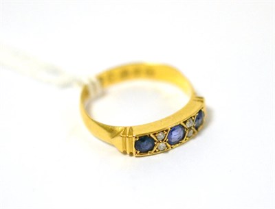 Lot 407 - A 22ct gold sapphire and diamond ring