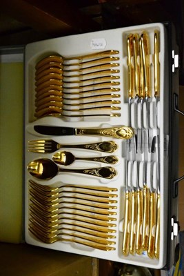 Lot 1023 - Cased gold plated seventy piece cutlery set