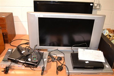 Lot 1088 - Two flat screen televisions and a group of four various DVD players and Freeview boxes