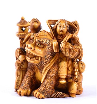 Lot 91 - A Japanese Ivory Okimono, Meiji period, of Seibo with a temple dog and attendants, signed...