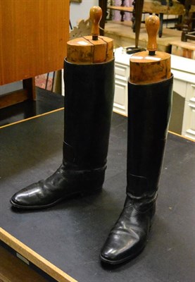 Lot 1107 - A pair of leather riding boots together with boot trees