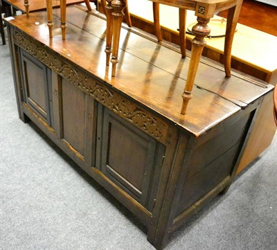 Lot 1123 - An 18th century carved oak blanket chest