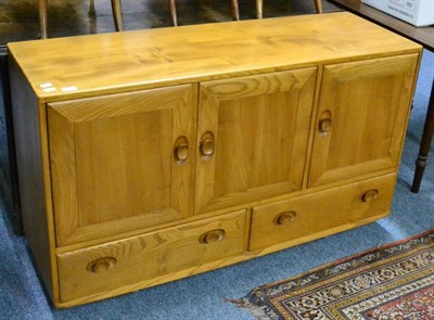 Lot 1125 - An Ercol light ash and elm sideboard