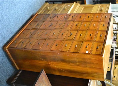 Lot 1135 - Cabinet fitted with an arrangement of drawers, together with two pine bedside cupboards (3)