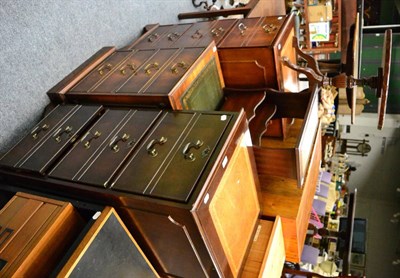 Lot 1138 - Group of reproduction leather inset furniture including a pair of filing cabinets, magazine...