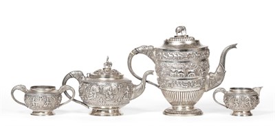 Lot 95 - An Indian White Metal Three PIece Tea Service, late 19th century, spherical form, decorated...
