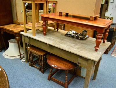 Lot 1147 - Oak coffee table, nest of three oak tables, columnar brass standard lamp and a walnut fold over...