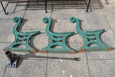 Lot 1181 - Three Victorian cast iron bench ends and a metal rivet plate with arm