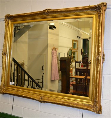 Lot 1190 - A large gilt mirror