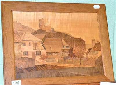 Lot 1206 - An oak framed marquetry picture of a village scene by C Spindler